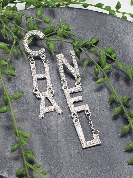 CHANEL letter earrings